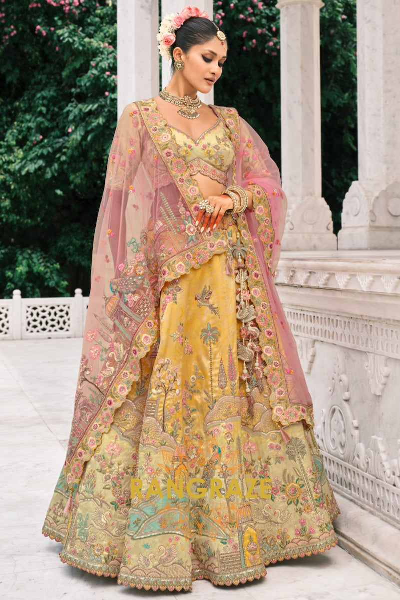 Golden Sunrise Pastel Yellow & Blush Pink Embroidered Bridal Lehenga – A Symphony of Radiance and Elegance