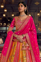 Pink And Yellow Banarasi Silk Lehenga WIth Hand Purse