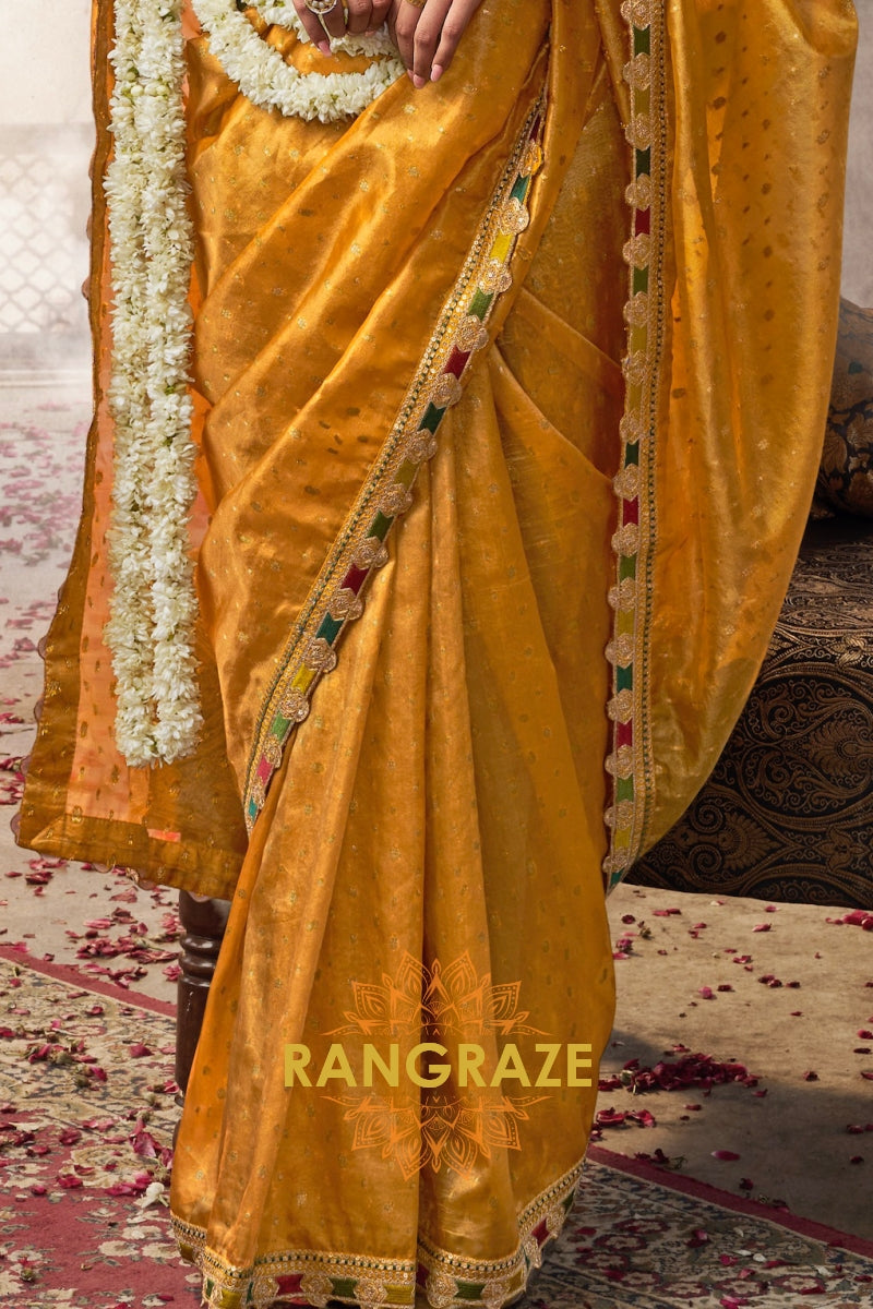 Golden Radiance Tissue Saree with Multicolored Lace and Embroidered Blouse