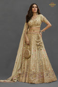 Cream Gold Heavy Work Banarasi Silk Lehenga With Clutch