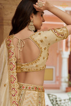 Cream Gold Heavy Work Banarasi Silk Lehenga With Clutch