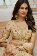 Cream Gold Heavy Work Banarasi Silk Lehenga With Clutch