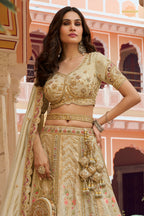 Cream Gold Heavy Work Banarasi Silk Lehenga With Clutch