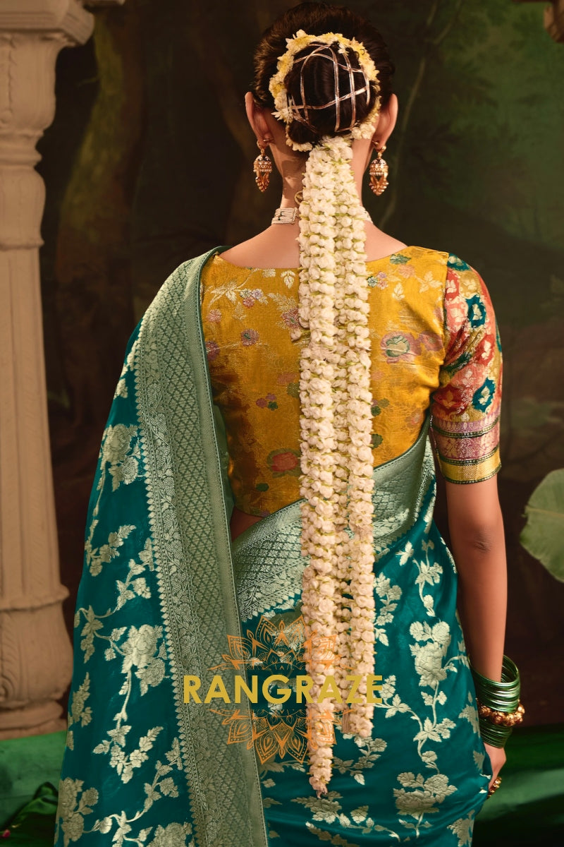 Enchanted Teal Banarasi Silk Saree with Golden Floral Grandeur