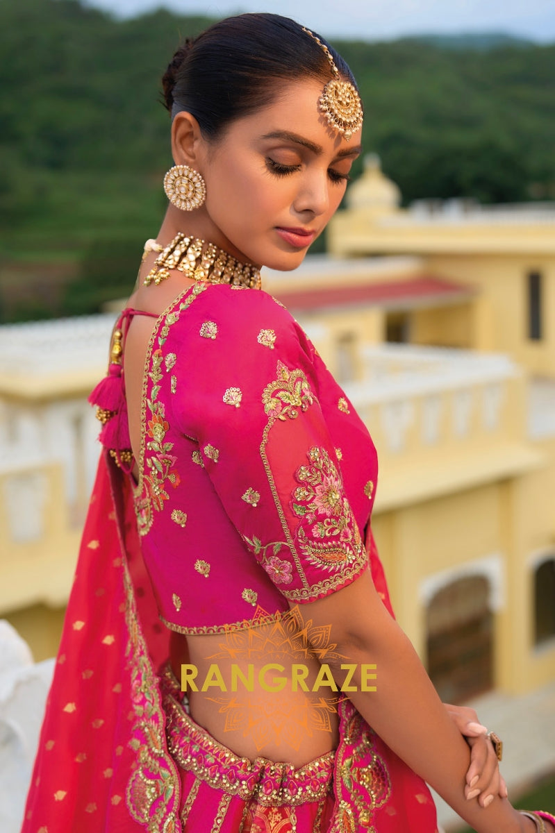 Blush Radiance Fuchsia and Gold Regal Lehenga – A Masterpiece of Traditional Elegance