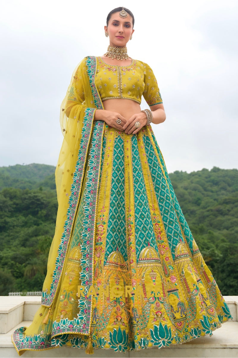 Peacock Paradise Yellow and Teal Handcrafted Heritage Lehenga – A Celebration of Grandeur