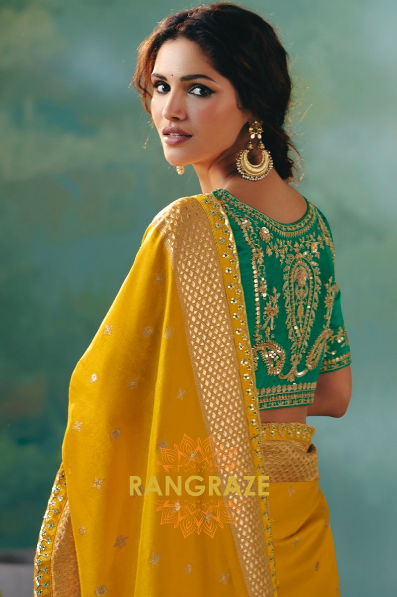 Mustard Yellow Silk Saree with Gold Zari Weaving and Emerald Green Embroidered Blouse