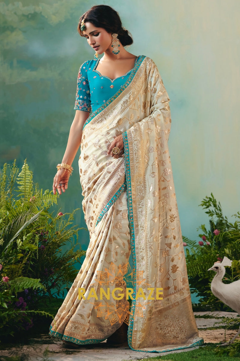 Ivory Sky Blue Silk Saree with Zari Weaving and Contrast Embroidered Blouse