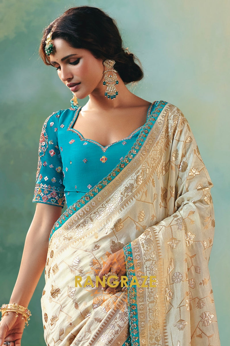 Ivory Sky Blue Silk Saree with Zari Weaving and Contrast Embroidered Blouse