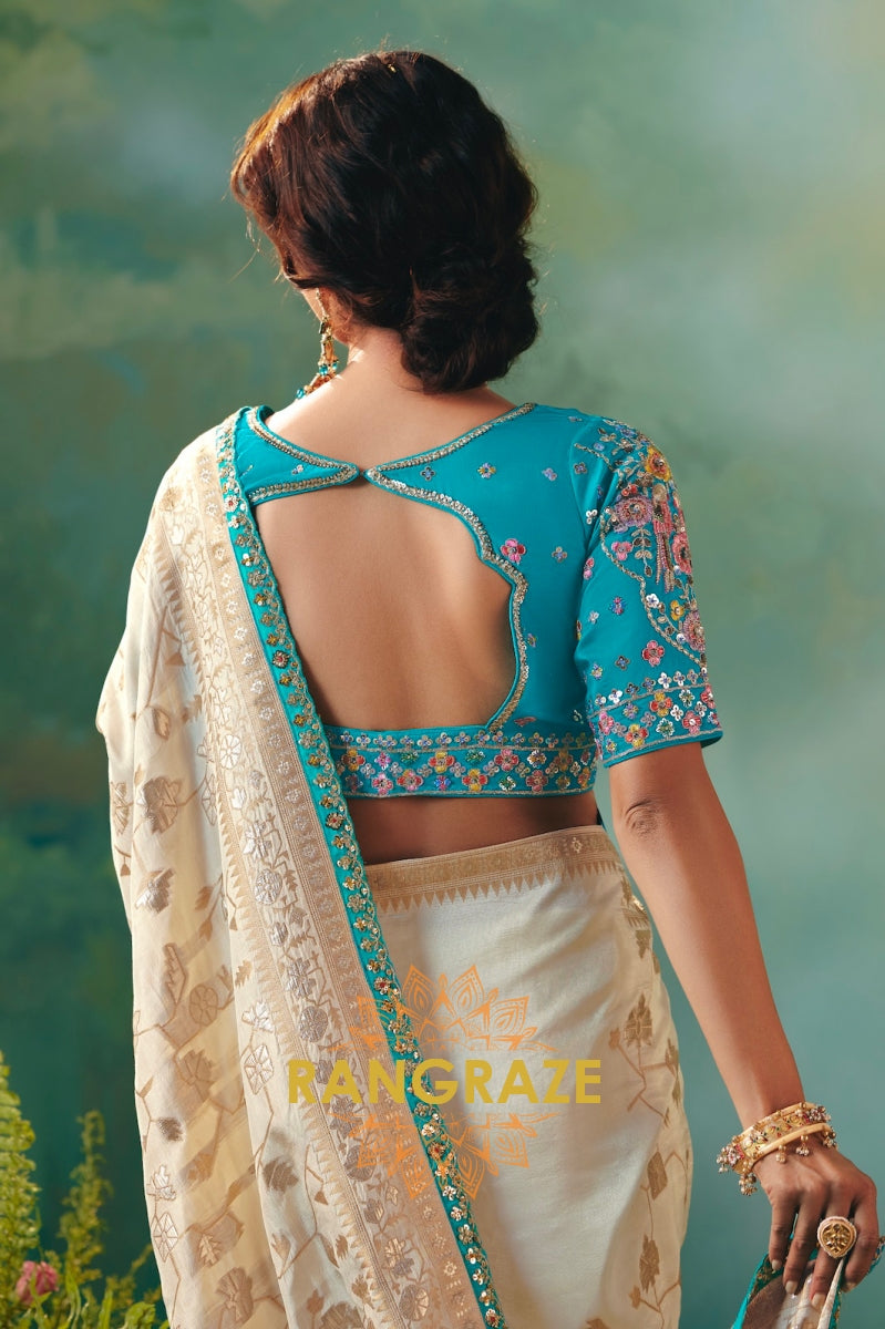 Ivory Sky Blue Silk Saree with Zari Weaving and Contrast Embroidered Blouse