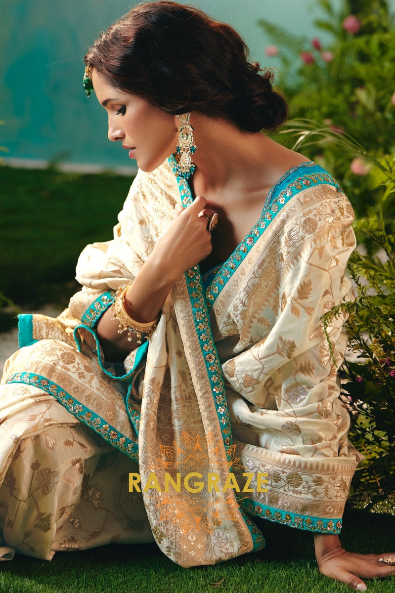Ivory Sky Blue Silk Saree with Zari Weaving and Contrast Embroidered Blouse
