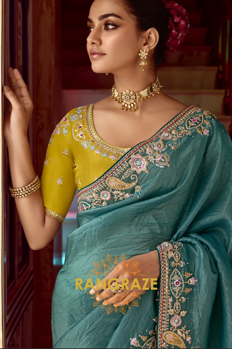 Mystic Teal Saree – A Symphony of Elegance