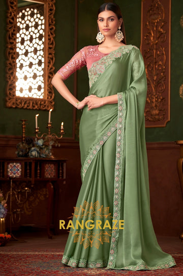 Graceful Green Designer Saree with Peach Pink Blouse