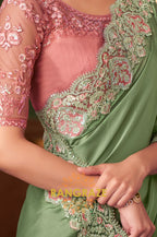 Graceful Green Designer Saree with Peach Pink Blouse