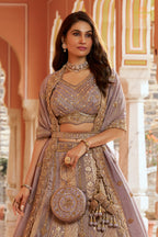 Mauve Heavy Work Banarasi Silk Lehenga With Clutch