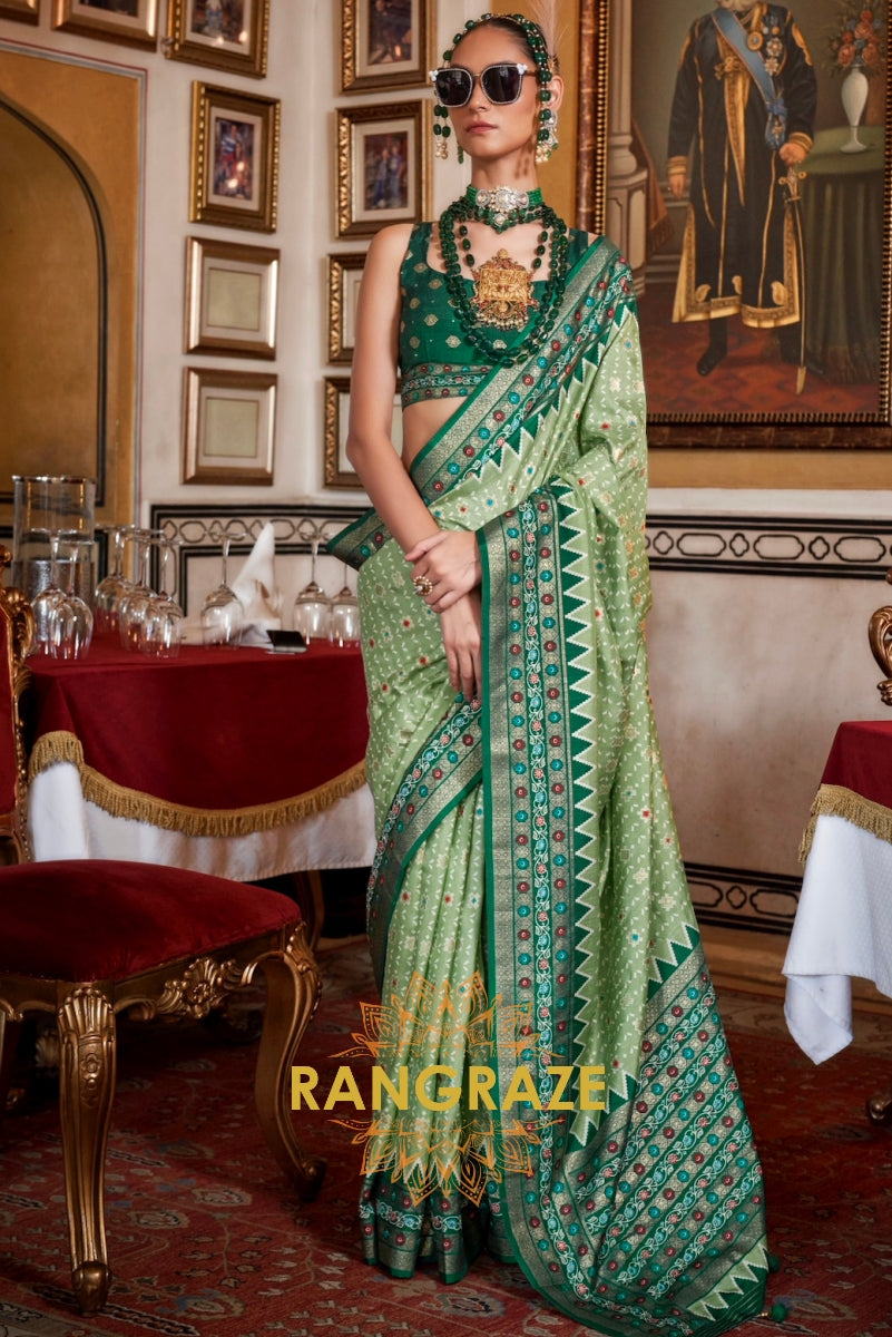 Celestial Sage Patola Silk Saree with Emerald Weaving Border