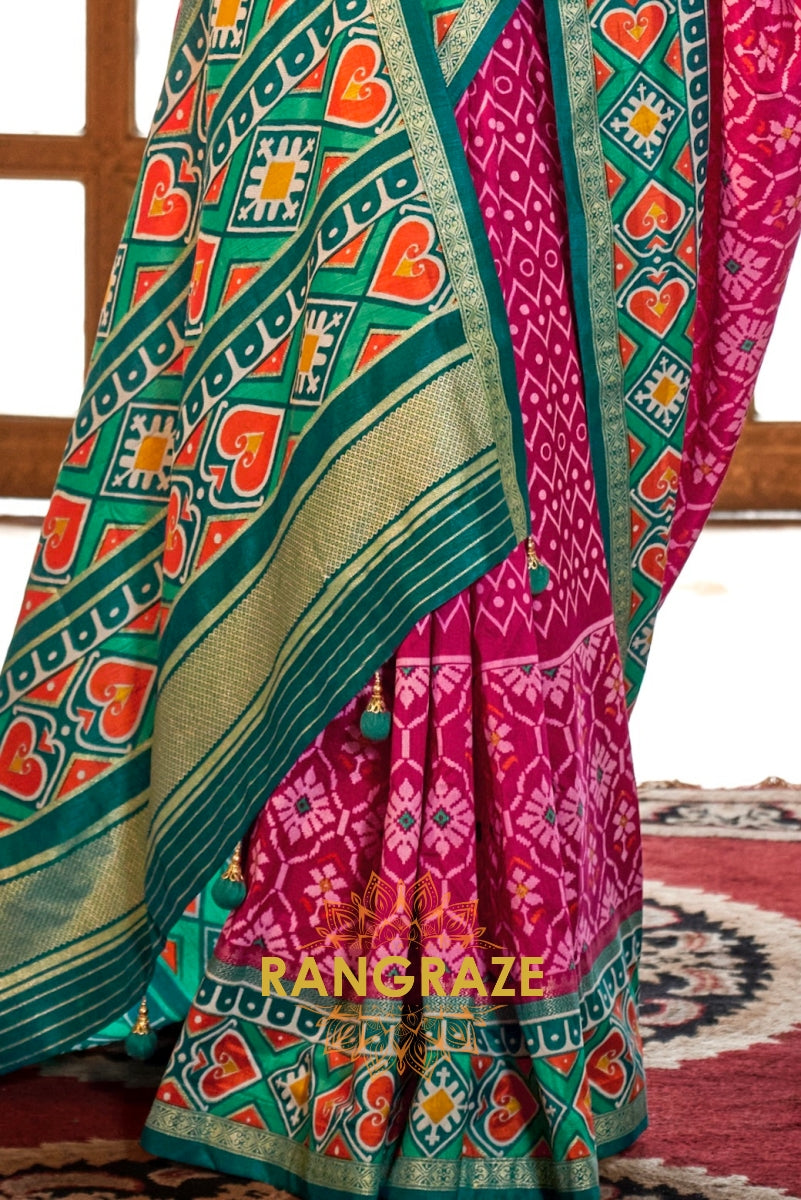Vibrant Fuchsia and Teal Green Patola Silk Saree with Contrasting Border