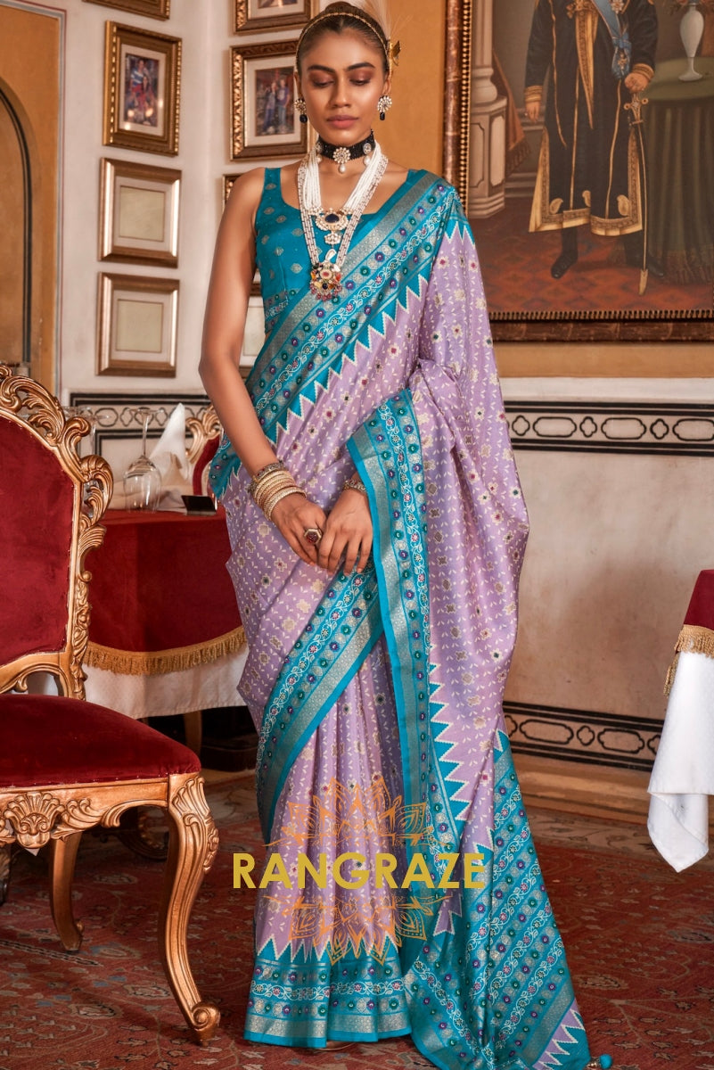 Serene Lilac Patola Silk Saree with Turquoise Weaving Border