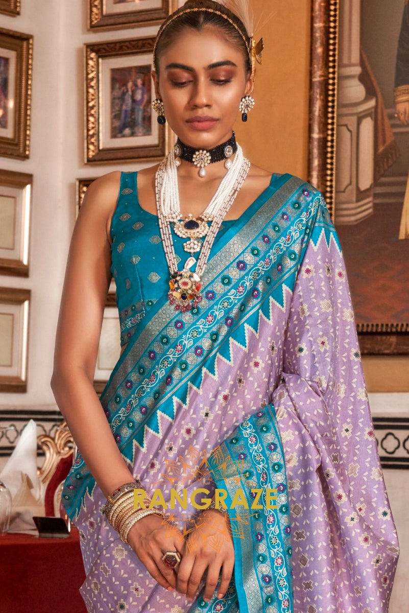 Serene Lilac Patola Silk Saree with Turquoise Weaving Border