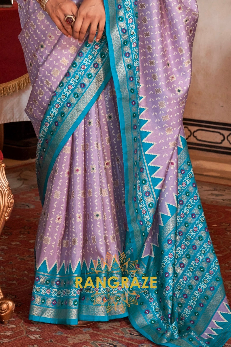 Serene Lilac Patola Silk Saree with Turquoise Weaving Border