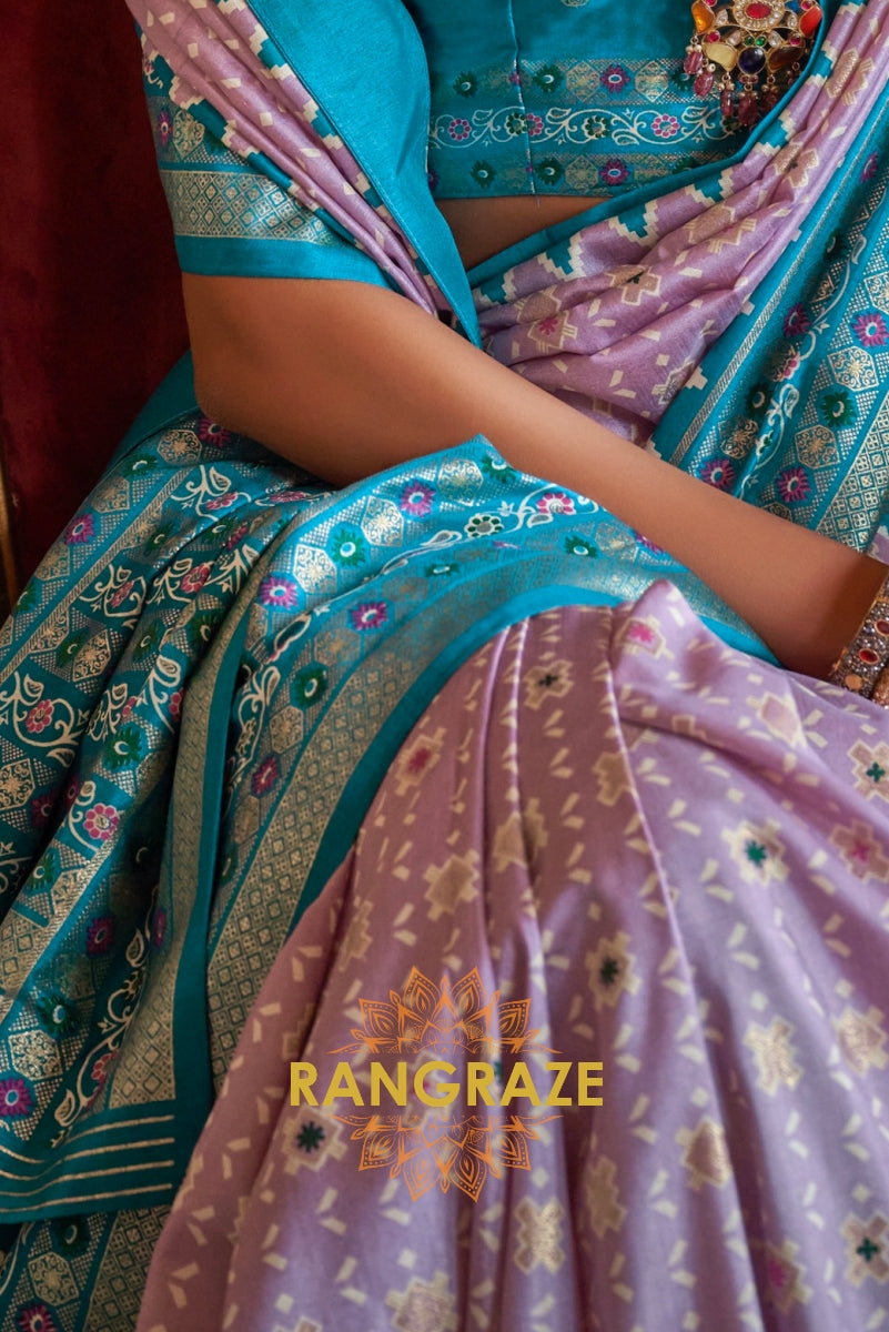 Serene Lilac Patola Silk Saree with Turquoise Weaving Border