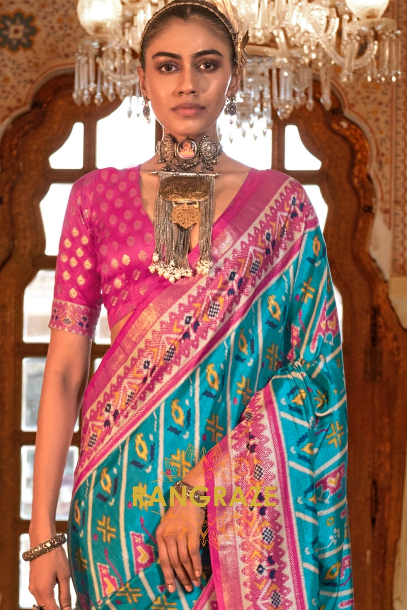 Turquoise and Fuchsia Patola Silk Saree with Floral Border