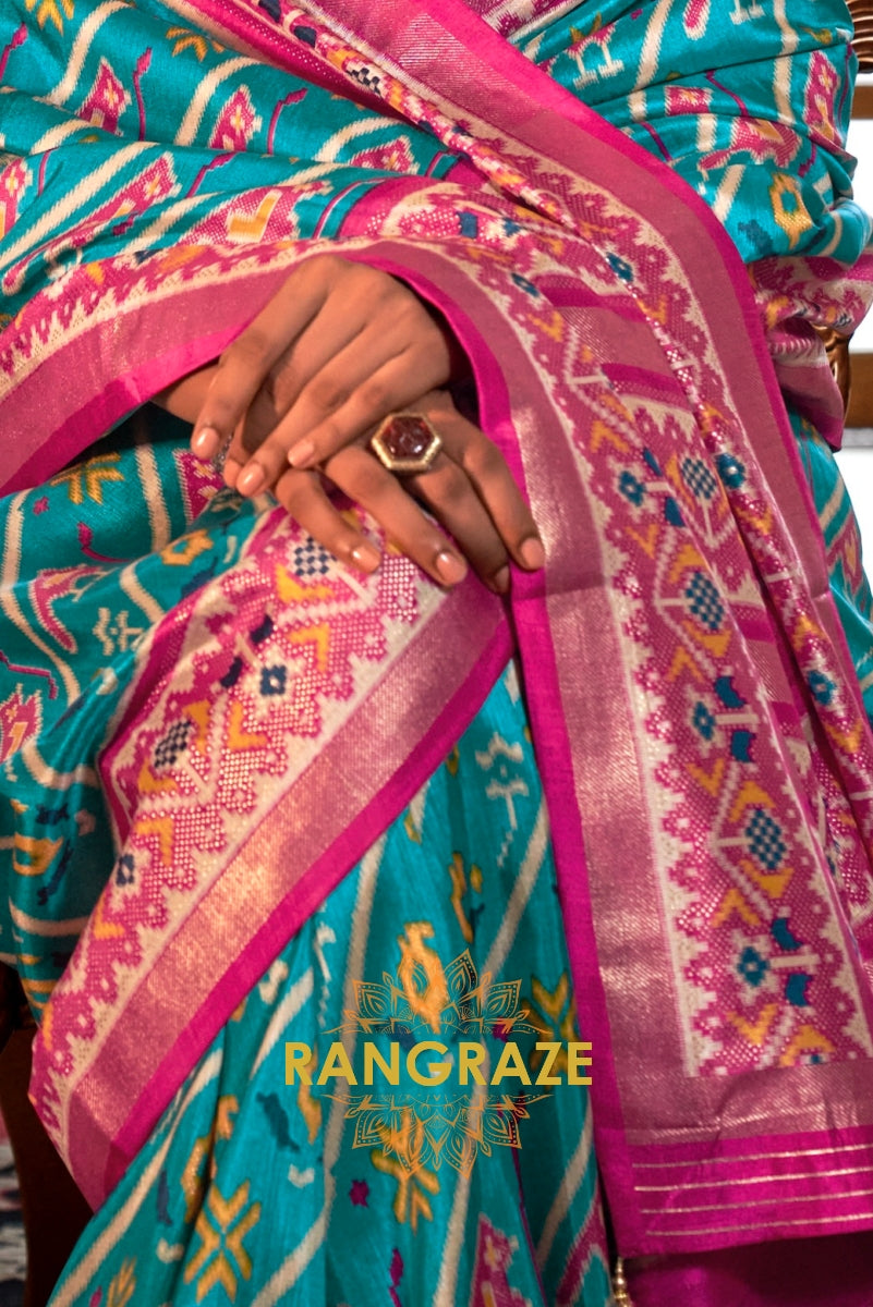 Turquoise and Fuchsia Patola Silk Saree with Floral Border