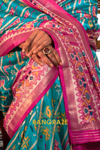 Turquoise and Fuchsia Patola Silk Saree with Floral Border