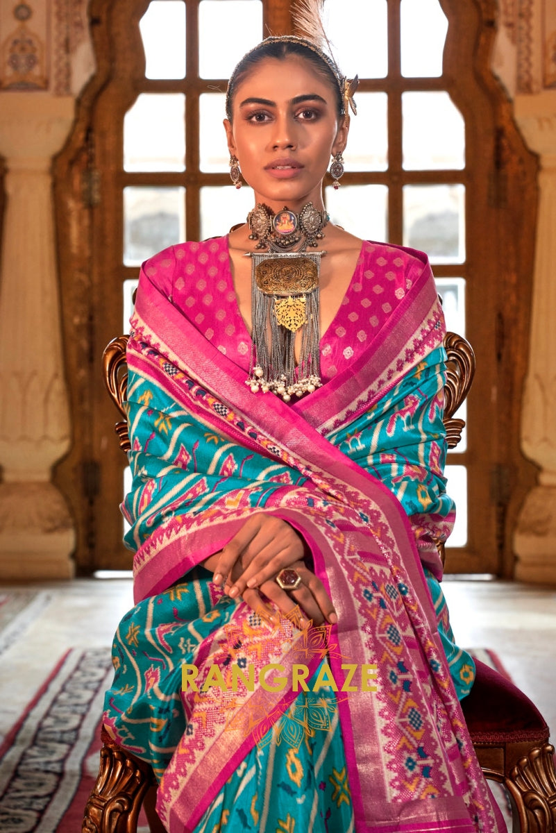 Turquoise and Fuchsia Patola Silk Saree with Floral Border