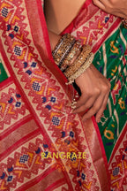 Majestic Emerald and Red Patola Silk Saree with Ornate Border