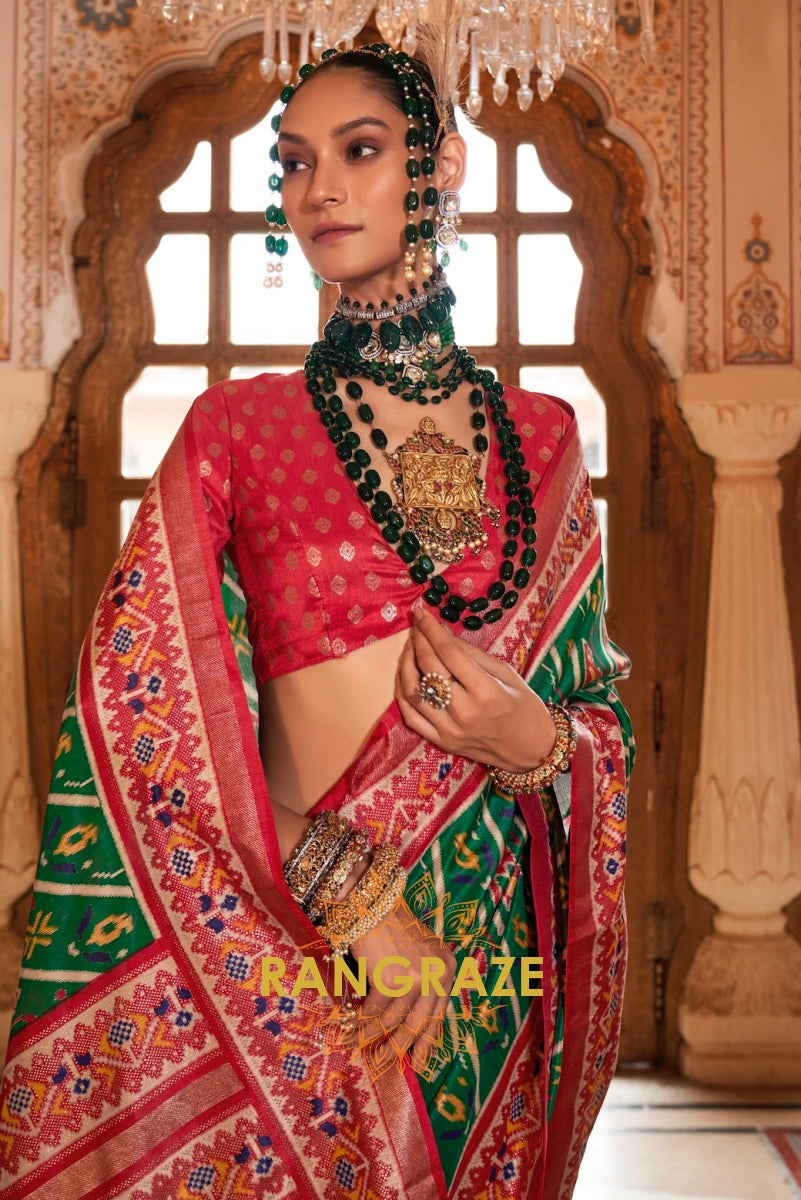 Majestic Emerald and Red Patola Silk Saree with Ornate Border