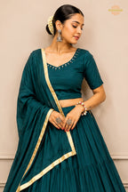 Teal Green Tiered Flared Lehenga Choli with Real Mirror Work Neckline
